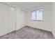 Bedroom features carpet floors, window, and closet at 3833 S Bahama St, Aurora, CO 80013