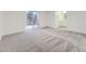 Spacious bedroom featuring carpeted floors, sliding door, and access to the balcony at 3833 S Bahama St, Aurora, CO 80013