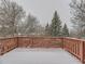 Snow covered deck with wooded views from elevated perch at 3833 S Bahama St, Aurora, CO 80013