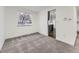 Bright and airy living room with new carpeting, offering comfortable living with views from the large window at 3833 S Bahama St, Aurora, CO 80013