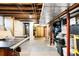 Spacious unfinished basement with exposed beams and ample storage space at 438 S Emerson St, Denver, CO 80209