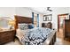 Cozy bedroom with a large bed, dark wood furniture, and soft lighting at 438 S Emerson St, Denver, CO 80209