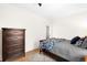 Comfortable bedroom with a wooden dresser and hardwood floors at 438 S Emerson St, Denver, CO 80209