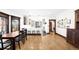 Open dining room with hardwood floors, connects to the kitchen, and provides ample space for gathering and entertaining at 438 S Emerson St, Denver, CO 80209