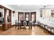 Bright dining room with hardwood floors, large windows, and views into the kitchen, ideal for entertaining at 438 S Emerson St, Denver, CO 80209