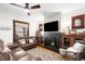 Relaxing living room featuring a fireplace, ceiling fan and a plush leather sofa at 438 S Emerson St, Denver, CO 80209