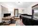 Bright office featuring a grand piano, desk and large windows at 438 S Emerson St, Denver, CO 80209