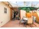 Outdoor patio features a dining table, an umbrella, and bifold doors to the kitchen at 438 S Emerson St, Denver, CO 80209