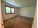 Well-lit carpeted bedroom with a window brings in natural light at 540 S Forest St # A2, Denver, CO 80246