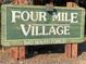 Community sign showing the neighborhood name and address: 'Four Mile Village, 540 South Forest' at 540 S Forest St # A2, Denver, CO 80246