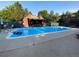 Community pool featuring an outdoor pergola and multiple lounge chairs, perfect for relaxation at 540 S Forest St # A2, Denver, CO 80246