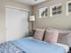 Comfortable bedroom with natural light, modern ceiling fan, and ample closet space, perfect for relaxation at 6162 W 28Th Ct, Edgewater, CO 80214