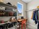 Organized closet with built-in shelving, perfect for storage and workspace with natural light at 6162 W 28Th Ct, Edgewater, CO 80214