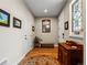 Charming entryway with hardwood floors, decorative mirror, and a lovely stained glass window at 6162 W 28Th Ct, Edgewater, CO 80214