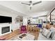 Open-concept living space with a fireplace, kitchen island, and stylish furnishings at 6162 W 28Th Ct, Edgewater, CO 80214