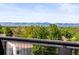 Stunning mountain views from rooftop deck overlooking lush greenery at 6162 W 28Th Ct, Edgewater, CO 80214