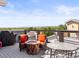 Relaxing rooftop deck with comfortable seating and a stunning mountain view at 6162 W 28Th Ct, Edgewater, CO 80214