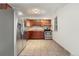 Kitchen with stainless steel appliances and wood cabinets at 12125 E Ford Ave, Aurora, CO 80012