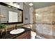 Bright bathroom featuring a glass enclosed shower with tiled surround and a granite countertop at 3720 Pecos Trl, Castle Rock, CO 80109