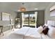 Serene bedroom with large windows providing natural light and views of the neighborhood at 3720 Pecos Trl, Castle Rock, CO 80109