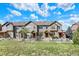 Charming townhome complex boasts a manicured lawn creating an inviting curb appeal at 3720 Pecos Trl, Castle Rock, CO 80109