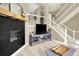 Bright and open living area with a fireplace, staircase, and media center, perfect for entertaining at 3720 Pecos Trl, Castle Rock, CO 80109