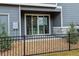Back porch area with chairs and a view into the home at 4588 S Versailles St # A, Aurora, CO 80015