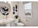 Contemporary powder room with sleek fixtures and stylish decorative accents at 4588 S Versailles St # A, Aurora, CO 80015