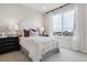Cozy bedroom with a white headboard and neutral decor at 4588 S Versailles St # A, Aurora, CO 80015