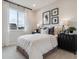 Bright bedroom with a large window and cozy decor at 4588 S Versailles St # A, Aurora, CO 80015
