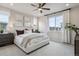 Inviting bedroom with a ceiling fan and large windows at 4588 S Versailles St # A, Aurora, CO 80015