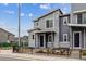 Stylish townhome with stone and gray siding, offering a modern and inviting curb appeal at 4588 S Versailles St # A, Aurora, CO 80015