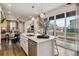 Modern kitchen with an island, stainless dishwasher, and an open concept to the rest of the home at 4588 S Versailles St # A, Aurora, CO 80015