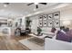 Bright living room area with modern decor, stylish furniture, and an open connection to the kitchen at 4588 S Versailles St # A, Aurora, CO 80015