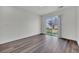 Bedroom with sliding glass door and backyard access at 5571 Killarney St, Denver, CO 80249