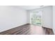 Bright bedroom boasts wood floors and a sliding glass door leading to the outdoor area at 5571 Killarney St, Denver, CO 80249