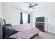 Comfortable bedroom with carpet, ceiling fan, and TV at 5571 Killarney St, Denver, CO 80249