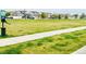View of a community park with dog waste station on the edge of a neighborhood at 5571 Killarney St, Denver, CO 80249