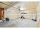Spacious unfinished garage with a concrete floor and white drywall at 5571 Killarney St, Denver, CO 80249