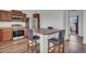 Eat-in kitchen features stainless steel appliances, granite countertops, and stylish seating area with barstool seating at 5571 Killarney St, Denver, CO 80249