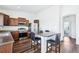 Modern kitchen with stainless steel appliances, a central island, and lots of cabinets at 5571 Killarney St, Denver, CO 80249