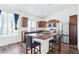 Modern kitchen with stainless steel appliances, a central island, and lots of cabinets at 5571 Killarney St, Denver, CO 80249