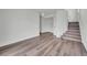 Bright room features wood floors and staircase access at 5571 Killarney St, Denver, CO 80249