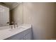 Modern bathroom with white vanity and updated fixtures at 2697 S Deframe Cir, Lakewood, CO 80228