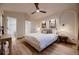 Spacious bedroom featuring a king-size bed and hardwood floors at 2697 S Deframe Cir, Lakewood, CO 80228