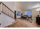 Bright dining area with hardwood floors and glass-top dining table at 2697 S Deframe Cir, Lakewood, CO 80228