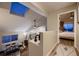 Upstairs hallway with skylight and view to bedroom and dining area at 2697 S Deframe Cir, Lakewood, CO 80228