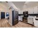 Modern kitchen with stainless steel appliances and white shaker cabinets at 2697 S Deframe Cir, Lakewood, CO 80228