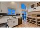 Kitchen with white cabinets, stainless steel appliances, and a view at 2697 S Deframe Cir, Lakewood, CO 80228