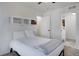 Cozy bedroom boasts a comfortable bed, built-in shelving, and neutral décor at 17838 E 54 Th Ave, Denver, CO 80249